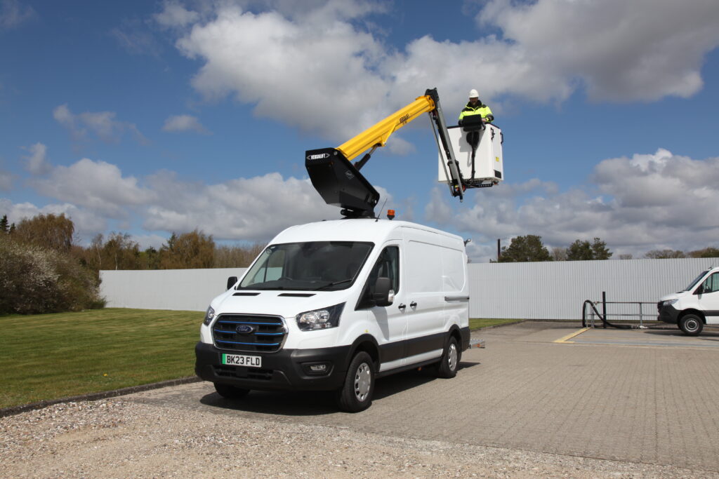 White van with cherry picker yellow boom all electric