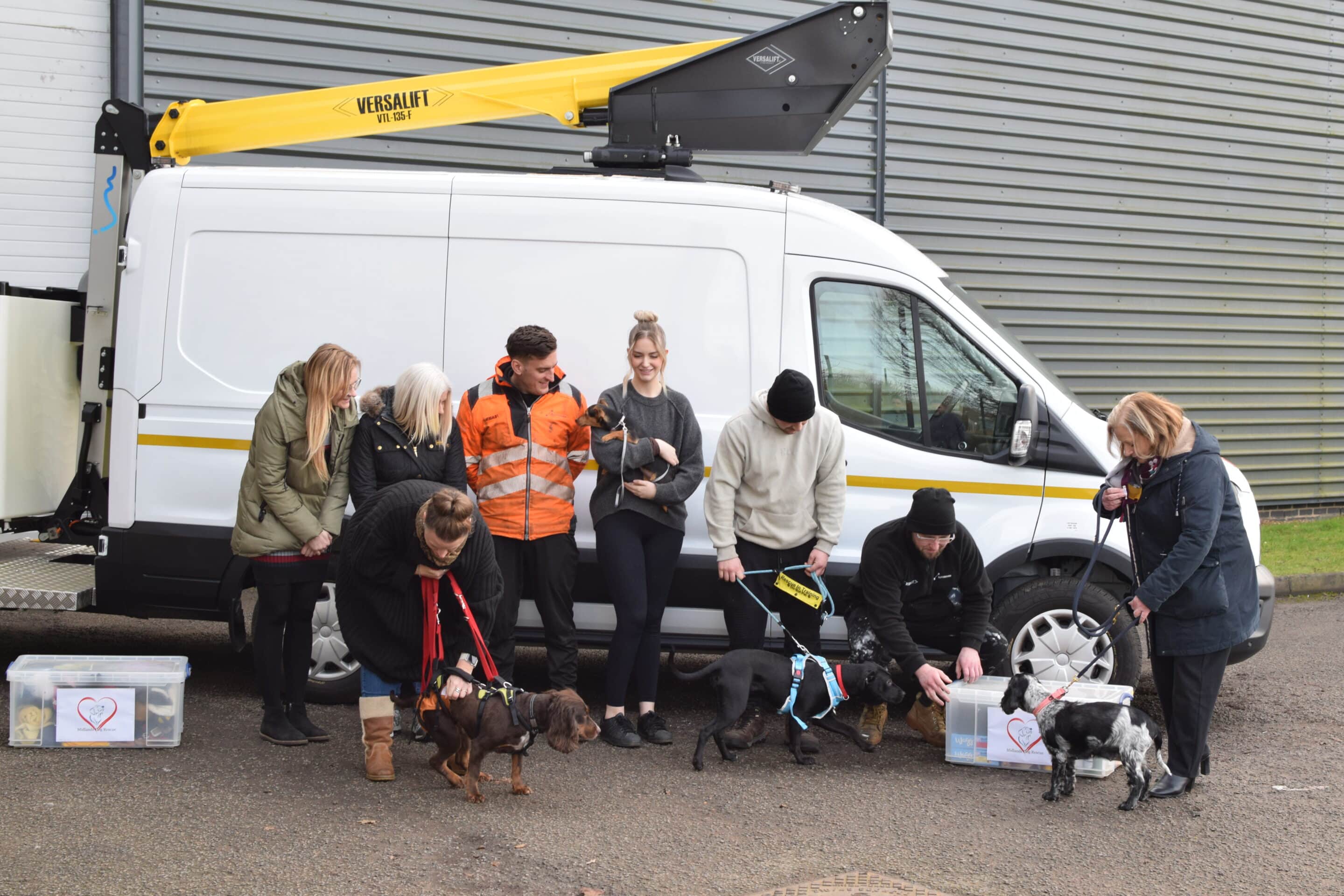 Versalift staff with dogs from Midlands Dog Rescue