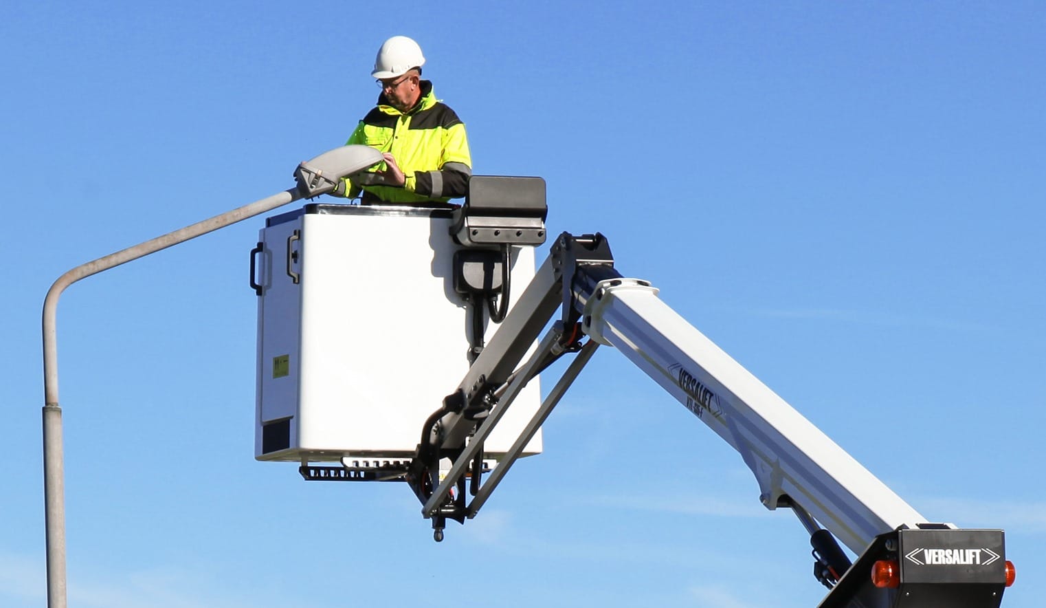Engineer working on a street light
