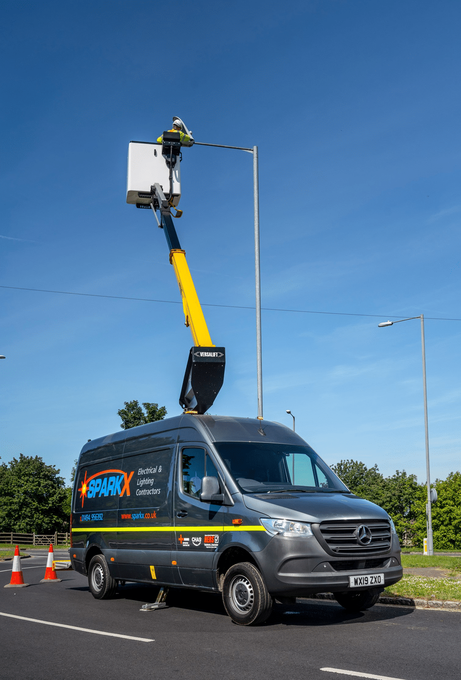 Sparx Versalift Van working on a Street Light