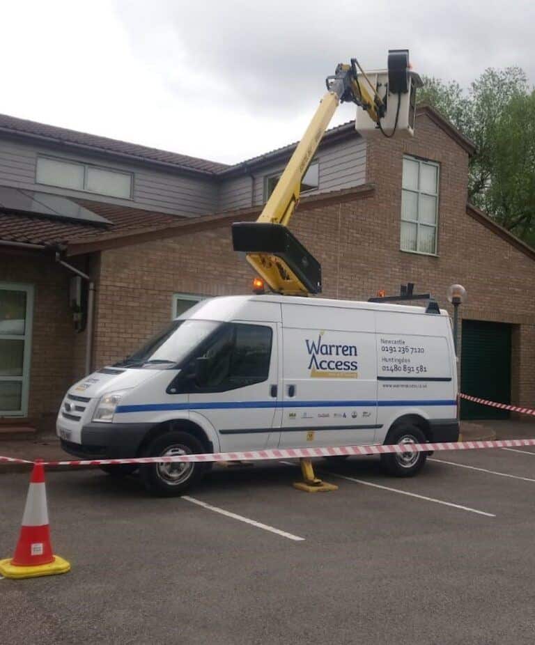 Versalift working on a building